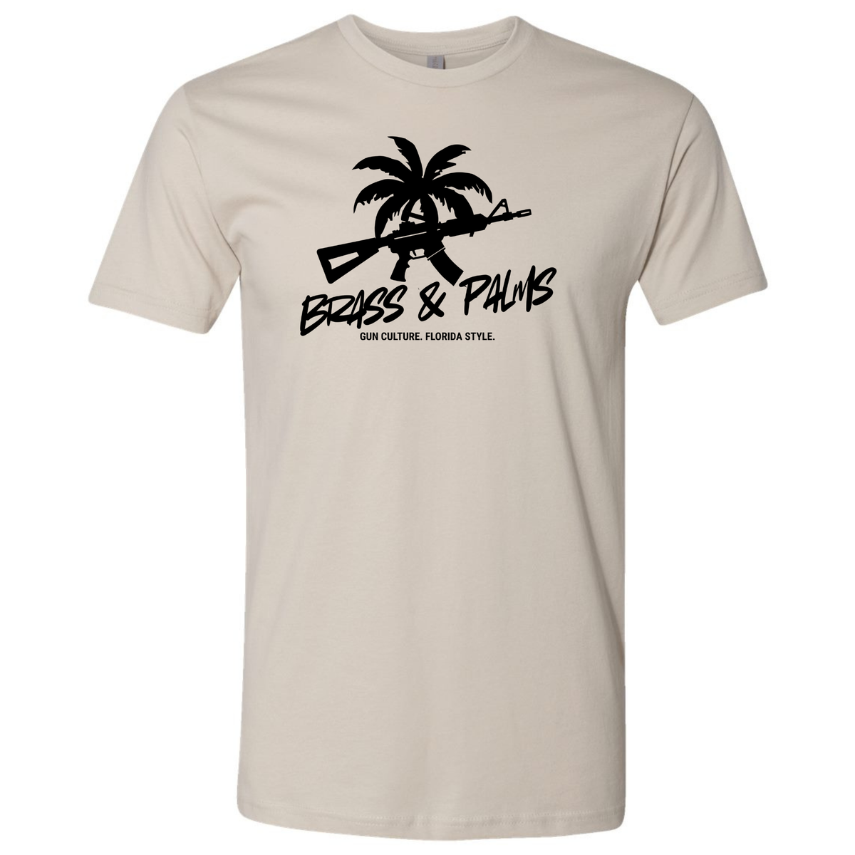 A sand colored crewneck t-shirt with a black graphic on the chest featuring a palm tree, an AR-15 rifle, and the text 'BRASS & PALMS' and 'GUN CULTURE. FLORIDA STYLE.'.