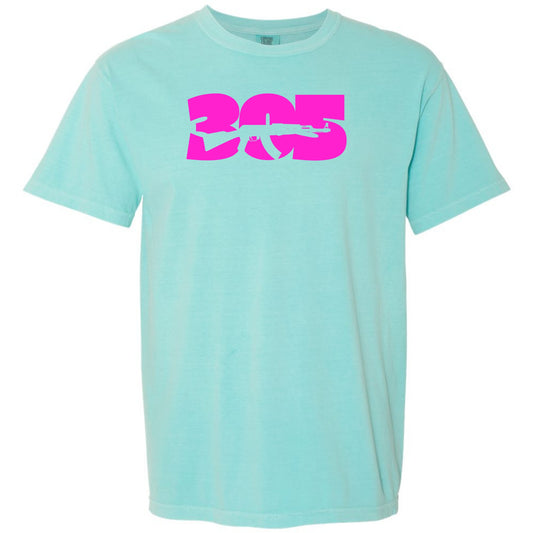 A chalky mint short-sleeve crewneck t-shirt featuring a large hot pink graphic on the chest that reads '305' Miami area code with a rifle silhouette integrated into the design, shown against a plain white background.