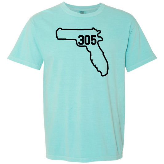 A light aqua blue short-sleeve t-shirt with a black graphic of the state outline of Florida containing Miami area code '305' on the chest, displayed against a solid white background.