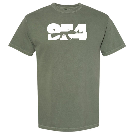 An olive green moss short-sleeve crewneck t-shirt featuring a bold white graphic print on the chest with the numbers '954' Fort Lauderdale area code and a silhouette of an AK-47 rifle.