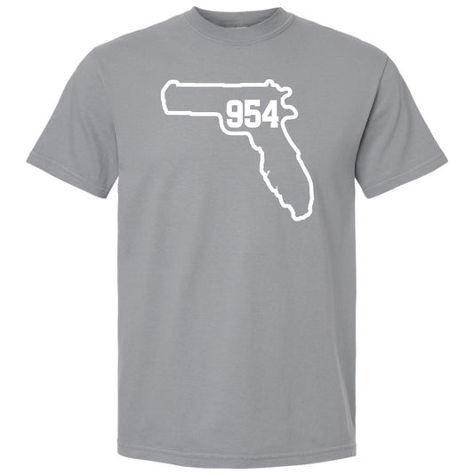 A granite gray short-sleeve crewneck t-shirt featuring a white graphic of the state outline of Florida with Fort Lauderdale area code '954' printed inside, displayed on a solid white background.