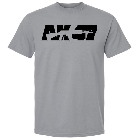 A light gray granite short-sleeve crewneck t-shirt featuring a black graphic print on the chest with the text 'AK-47' stylized as a rifle silhouette, shown against a plain white background.