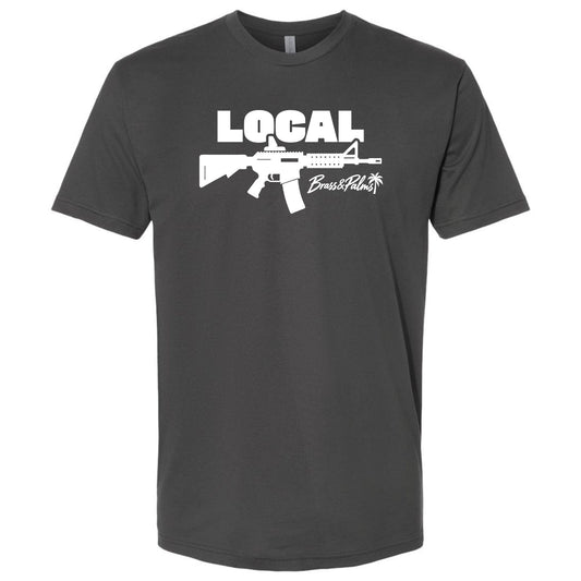 A dark charcoal modern fit -shirt with white LOCAL rifle artwork and Brass & Palms branding, Florida gun culture apparel.